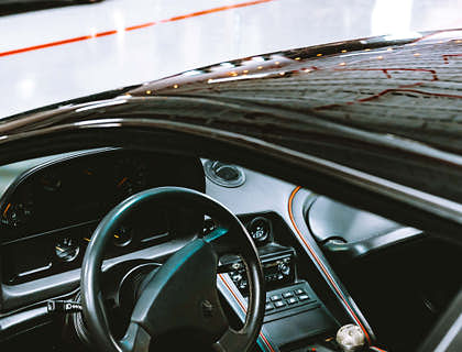 Interior of a manual transmission car at a transmission repair business.