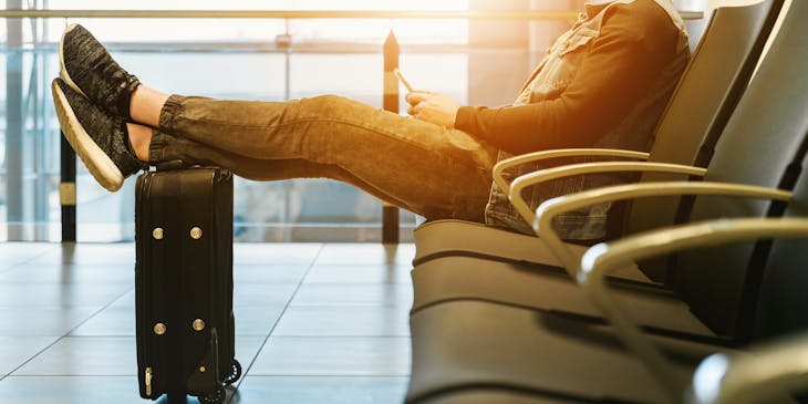 A man at an airport waiting to travel.