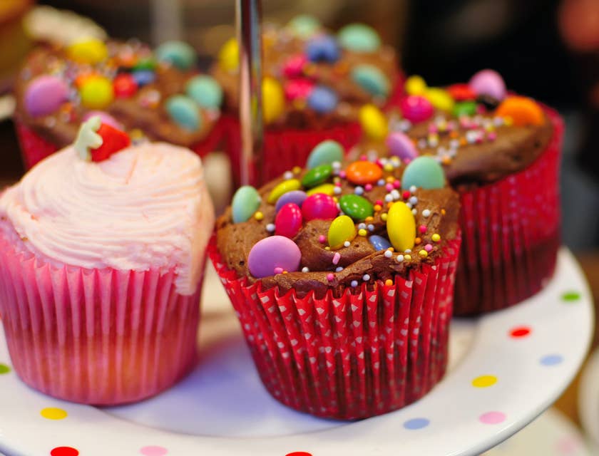 Assortment of colorful cupcakes for sale by a treat business.