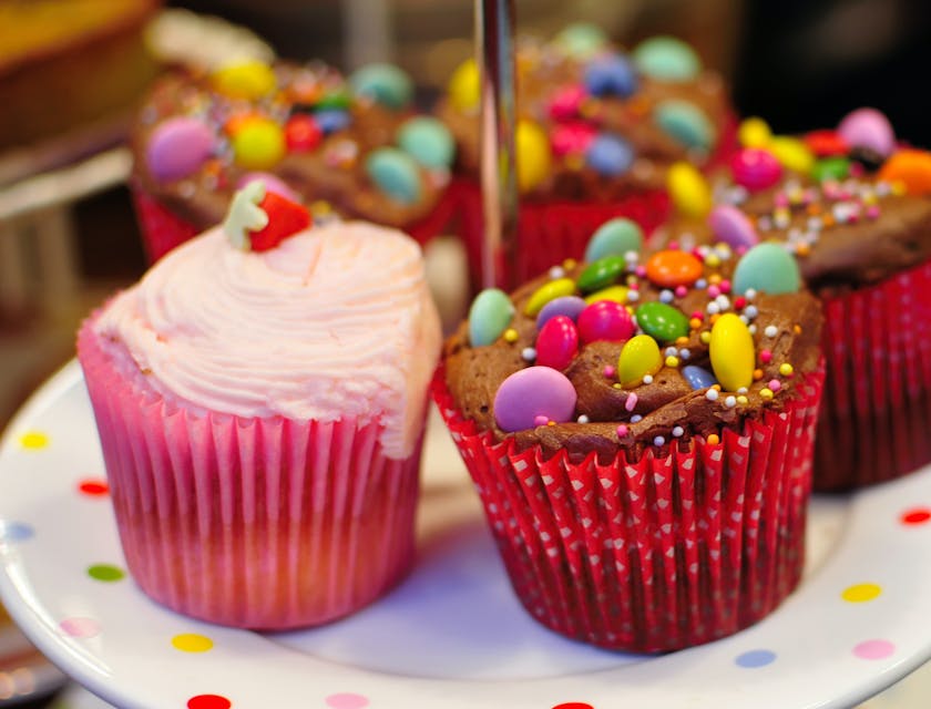 Assortment of colorful cupcakes for sale by a treat business.