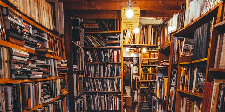 Room in a used bookstore filled with books.