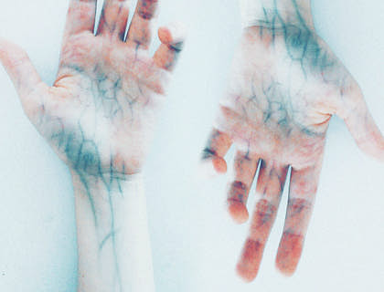 Two hands with blue veins.