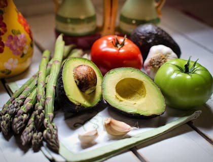 A vegan diet of assorted fruit and vegetables on a table.