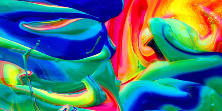 Vibrant paint colors mixed together.