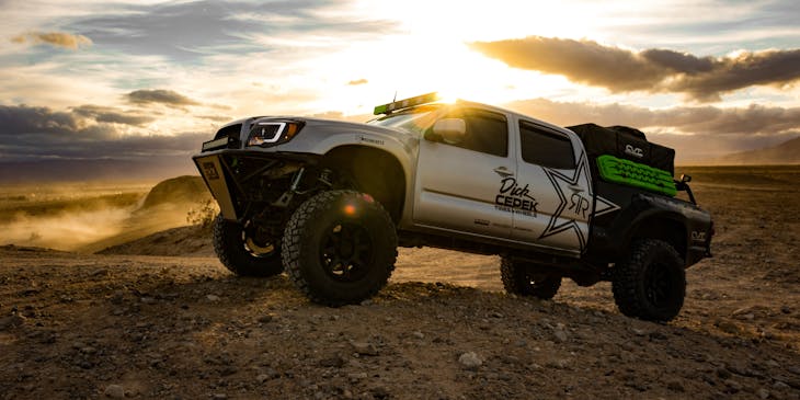 A truck displays its vinyl wrapping on a ridge.