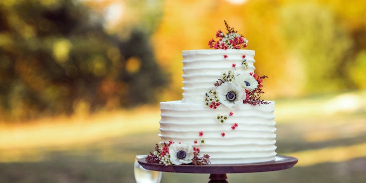 White and red floral wedding cake.