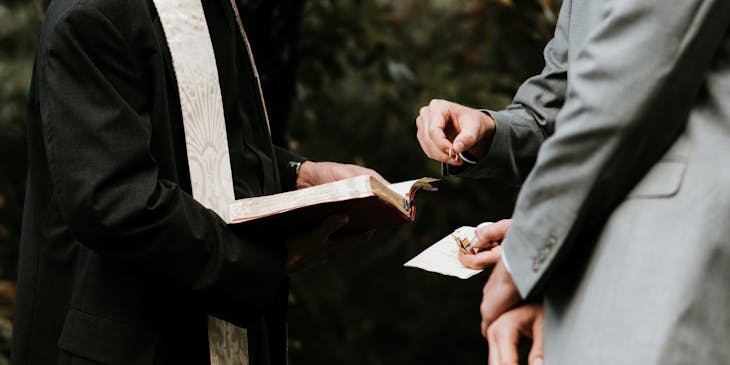 Wedding officiant marrying a couple.