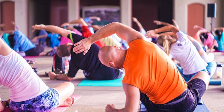 A group of people at a yoga business.