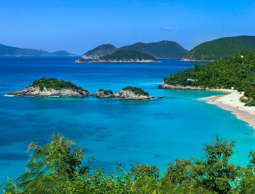 A white sand shoreline along Trunk Beach.