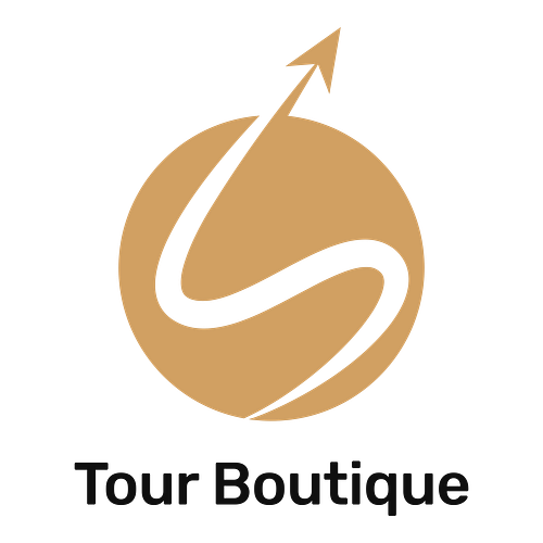 Un logo per un'agenzia di viaggio che si chiama Tour Boutique.